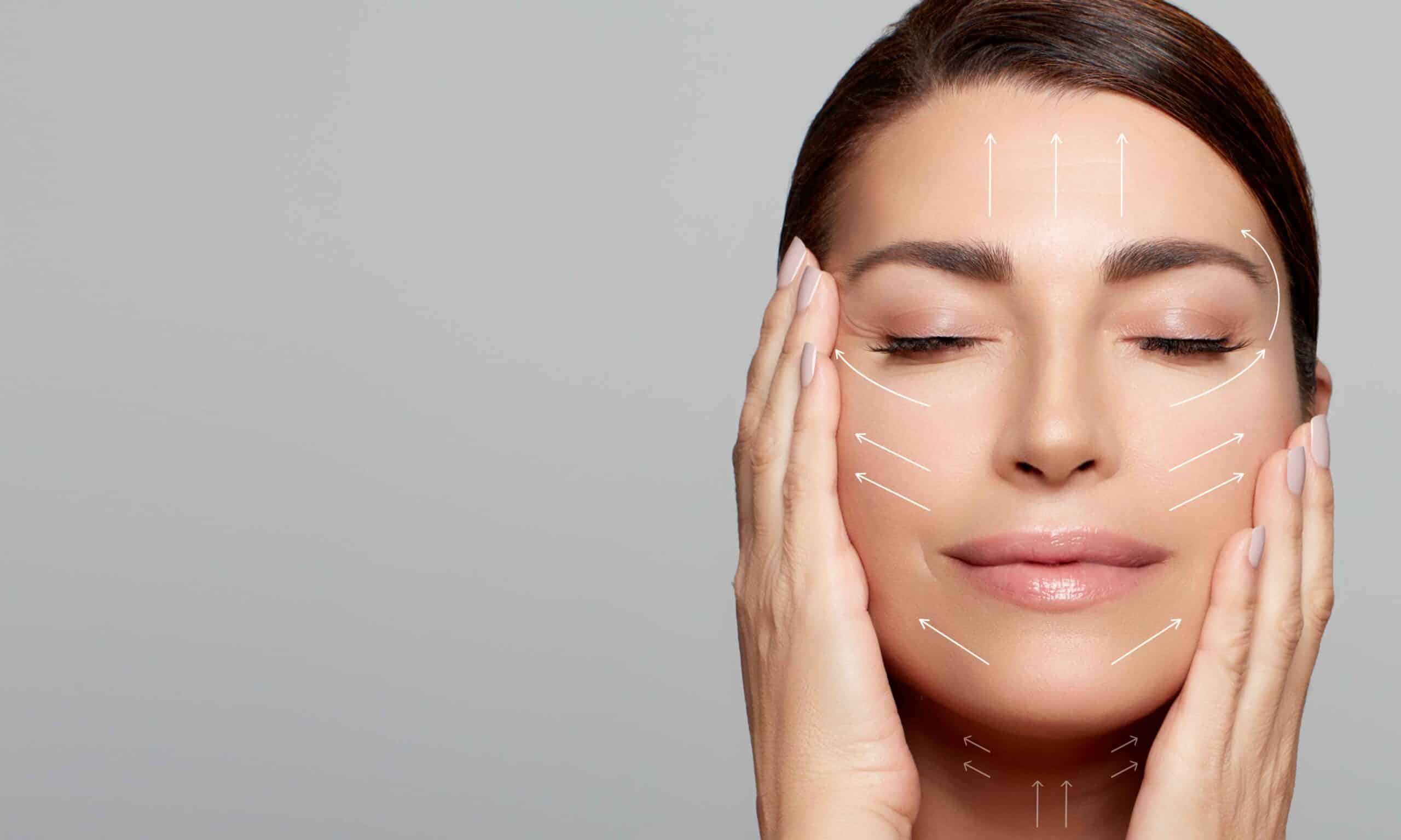 Facelift 2 Woman touching face with skin tightening guide lines.